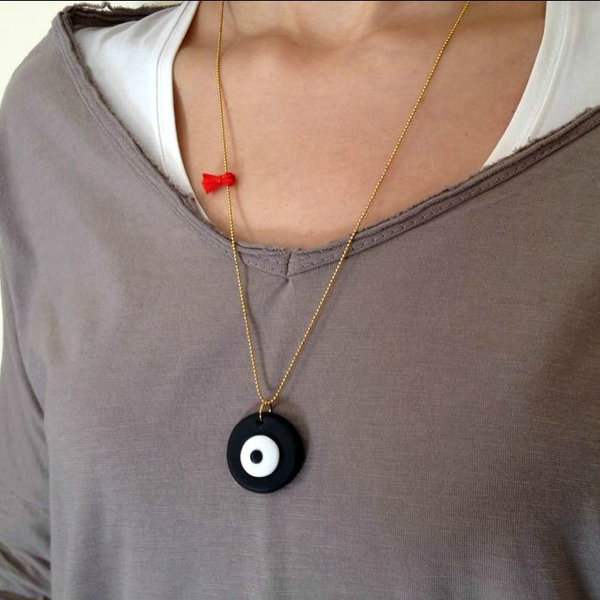 Evil eye and red tassel necklace